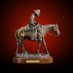 A bronze by Patsy Lane of a horse with sleeping rider